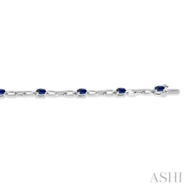 1/6 Ctw Round Cut Diamond & 5x3 MM Oval Cut Sapphire Precious Bracelet in 10K White Gold