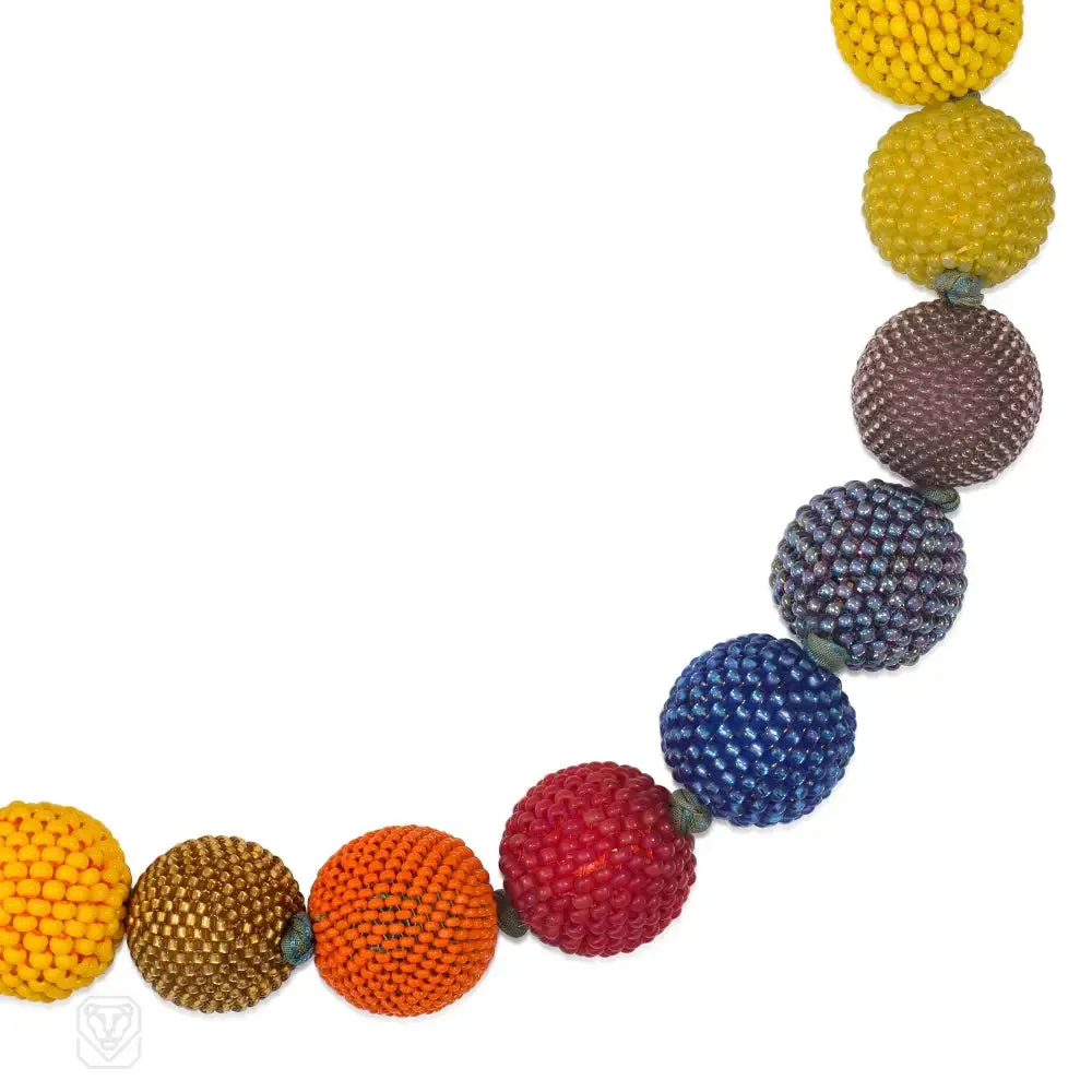 Handmade beaded ball necklace in mainly yellow, blue and green tones