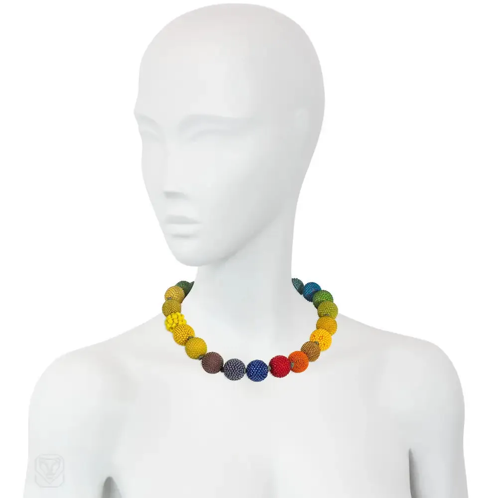 Handmade beaded ball necklace in mainly yellow, blue and green tones