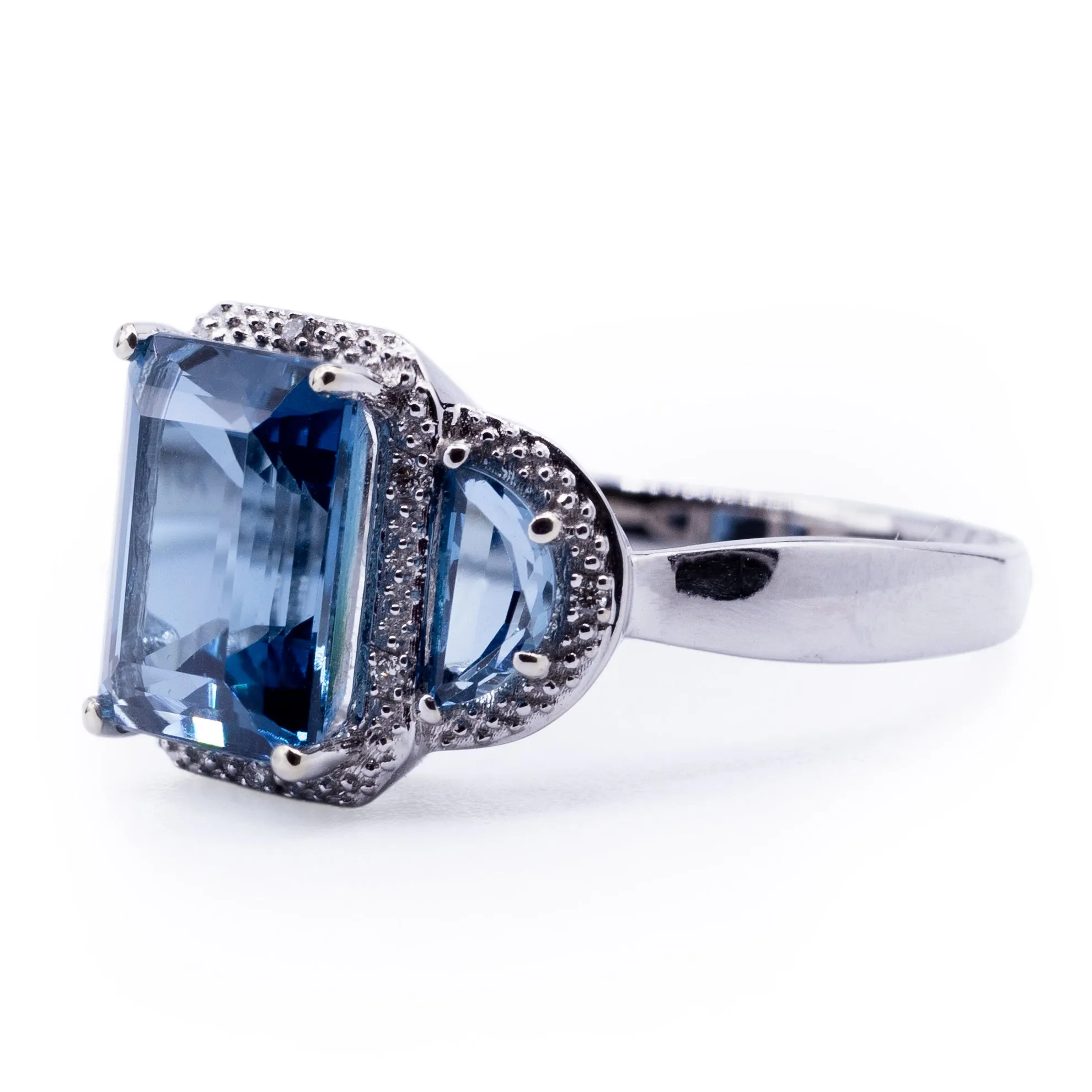 Three London Blue Topaz Stone Ring with Half Moon Side Stones and Diamond Accented Halo